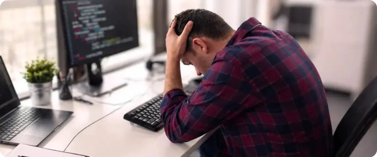 Alerting Software without filtering causes alert fatigue symbolized by a stresses out engineer