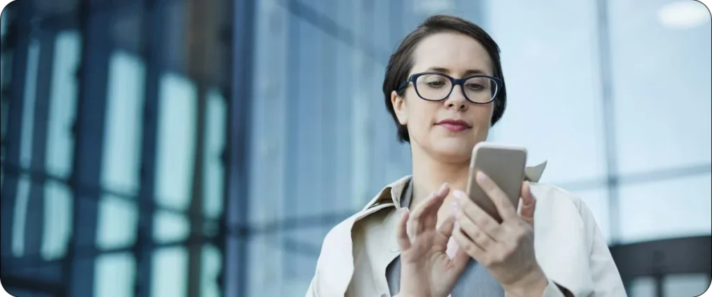 female engineer working with smartphone on the go